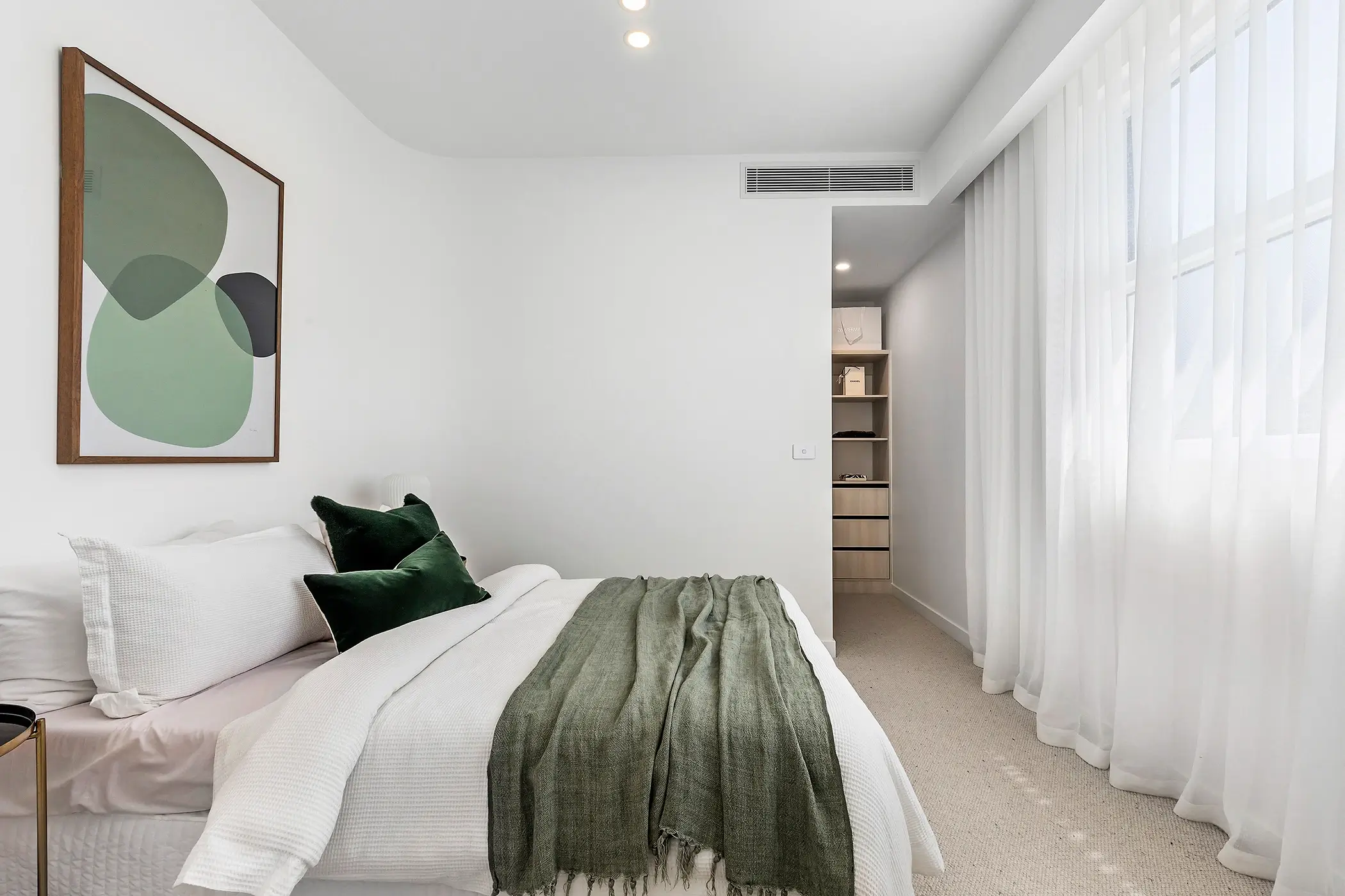 Shared Designer Bathroom with Skylight